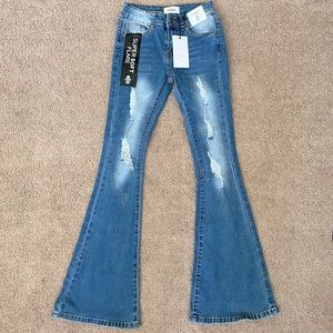 Distressed bell bottom jean with rhinestones